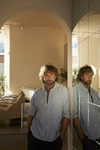 Daniel K Palmer in salon archway